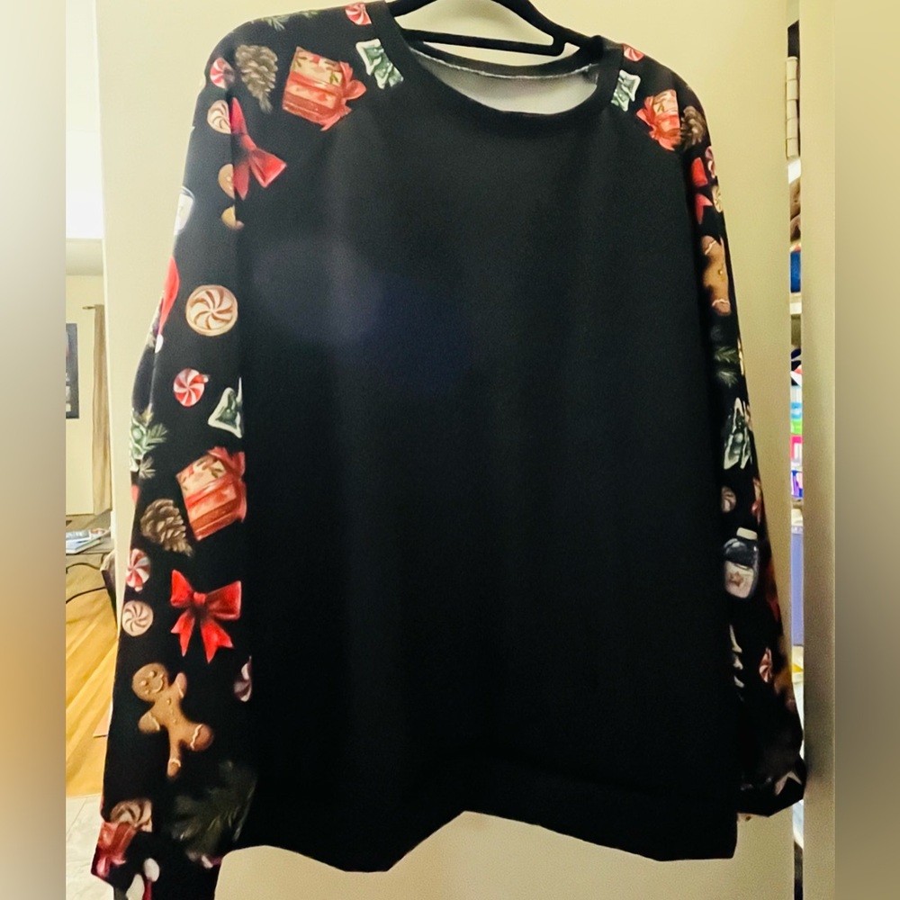 Festive Black crew neck shirt with Holiday Print Sleeves. Size XL
